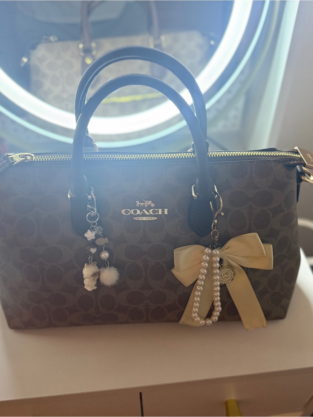 Coach Brown Signature Satchel with Black Handles and Cream Bow Charm